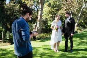 Photographer reviewing photographs on digital camera